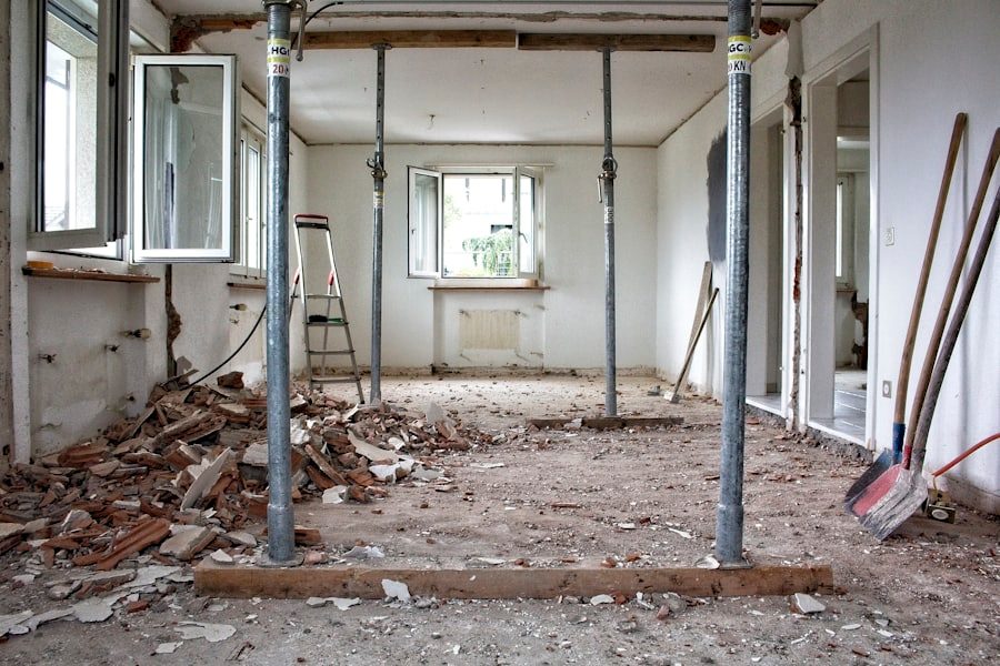 A home mid-renovation, with support poles, tools, and debris still on the floor